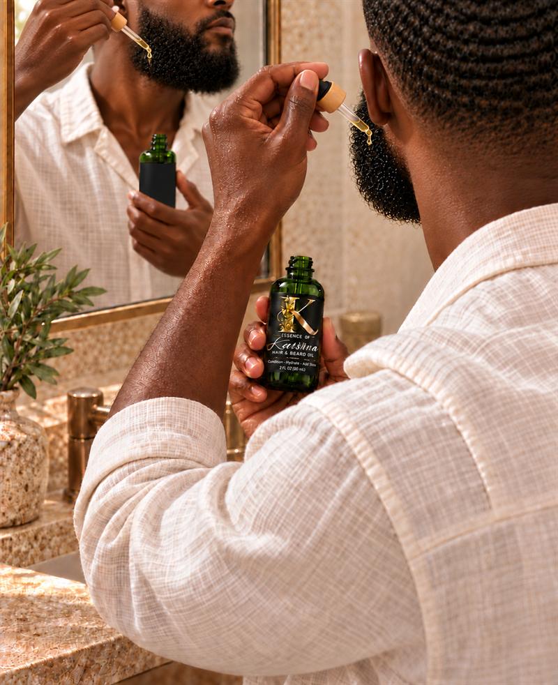 Man applying Karisma oil to his beard with a dropper in front of a mirror